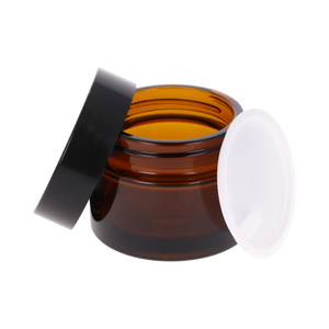 Brown glass jar 50 ml, ABS black cap, PP white overlay